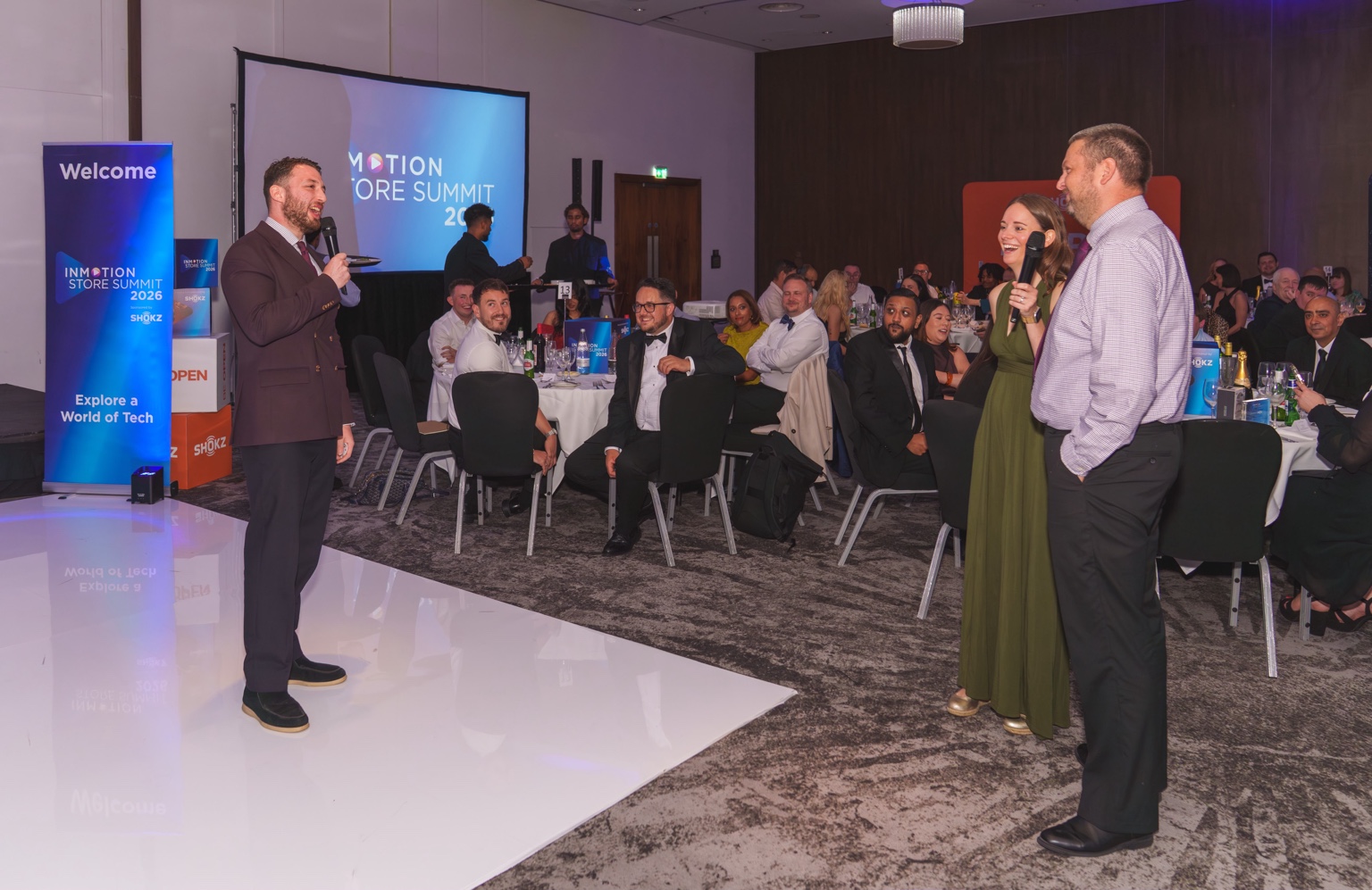 Kassim performing a larger group mentalism piece at a corporate event