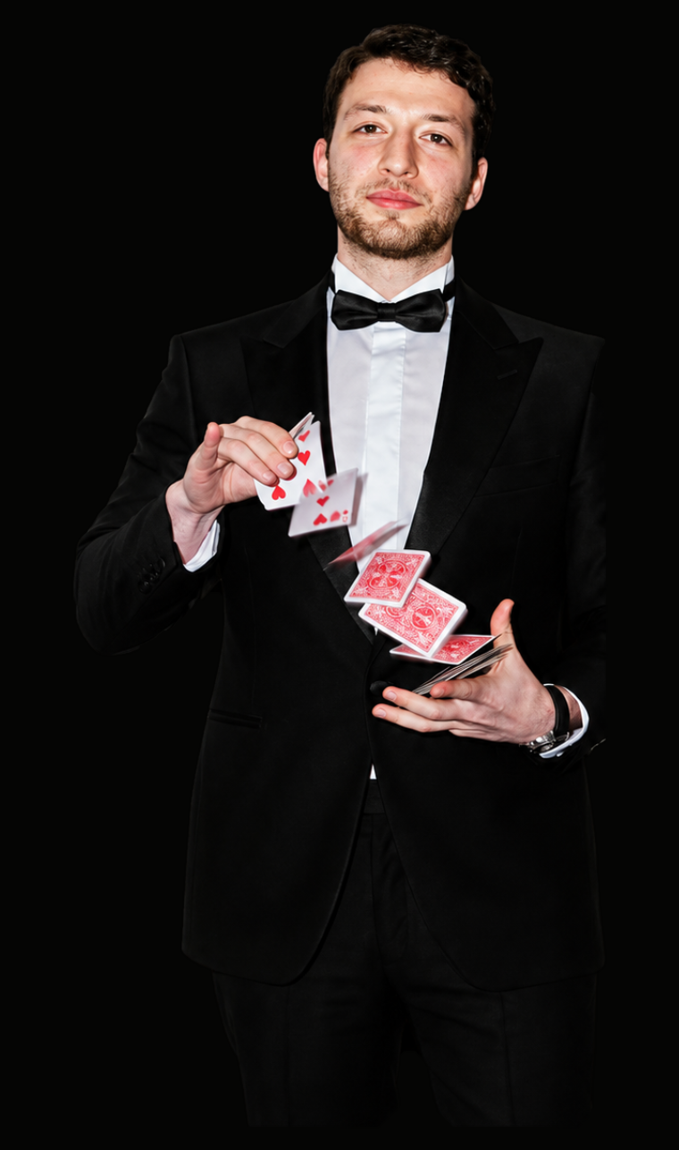 Kassim Beydoun performing close-up card magic in black tie