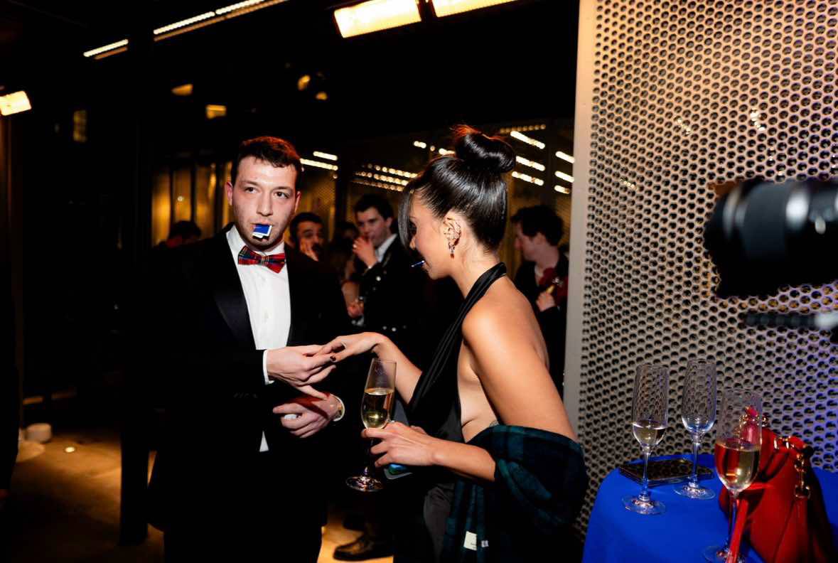 Kassim performing close-up magic at a private event