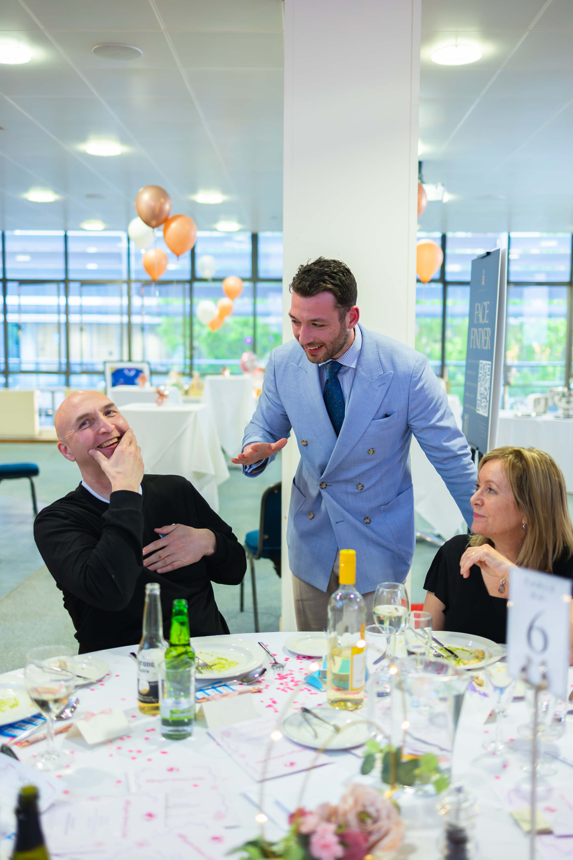 Kassim entertaining guests during dinner