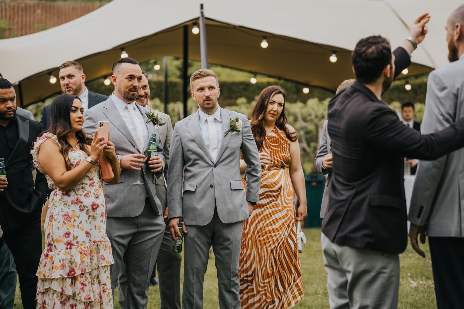 Kassim entertaining guests at an outdoor wedding